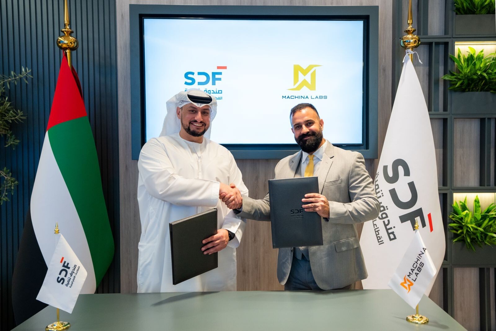 Edward Mehr, CEO and Co-Founder of Machina Labs, and Abdulla Naser Al Jaabari, Managing Director and CEO of SDF, during the signing of the initial partnership and investment agreement in the UAE.